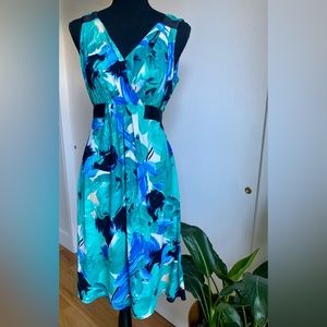 Beautiful Scarlett green/blue sleeveless floral dress with black ribbon in back.